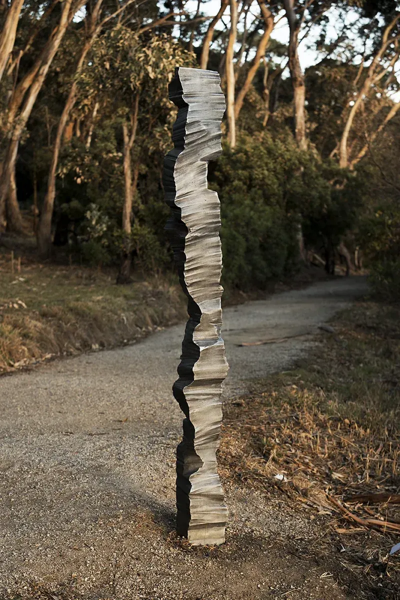 The column beside a gravel track among eucalypts
