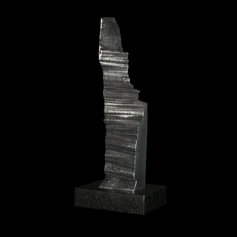 Impression 1, a cast aluminium column on a granite base against black