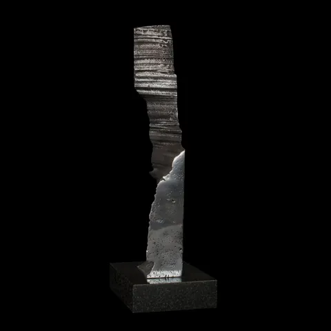 Impression 1 from the side, showing layered and smooth faces